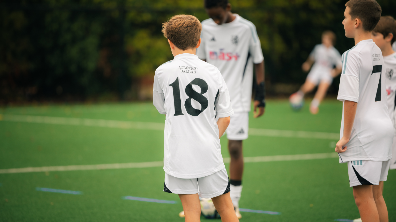 Coach speaking to team during a training session